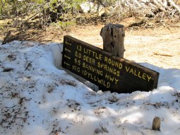 Sign at Saddle Junction buried in snow